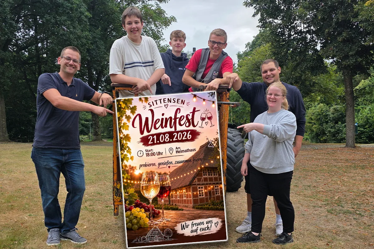 Six people outdoors pose around a large Weinfest poster (Sittensen) dated 21.08.2026, smiling and pointing to it in a park setting.